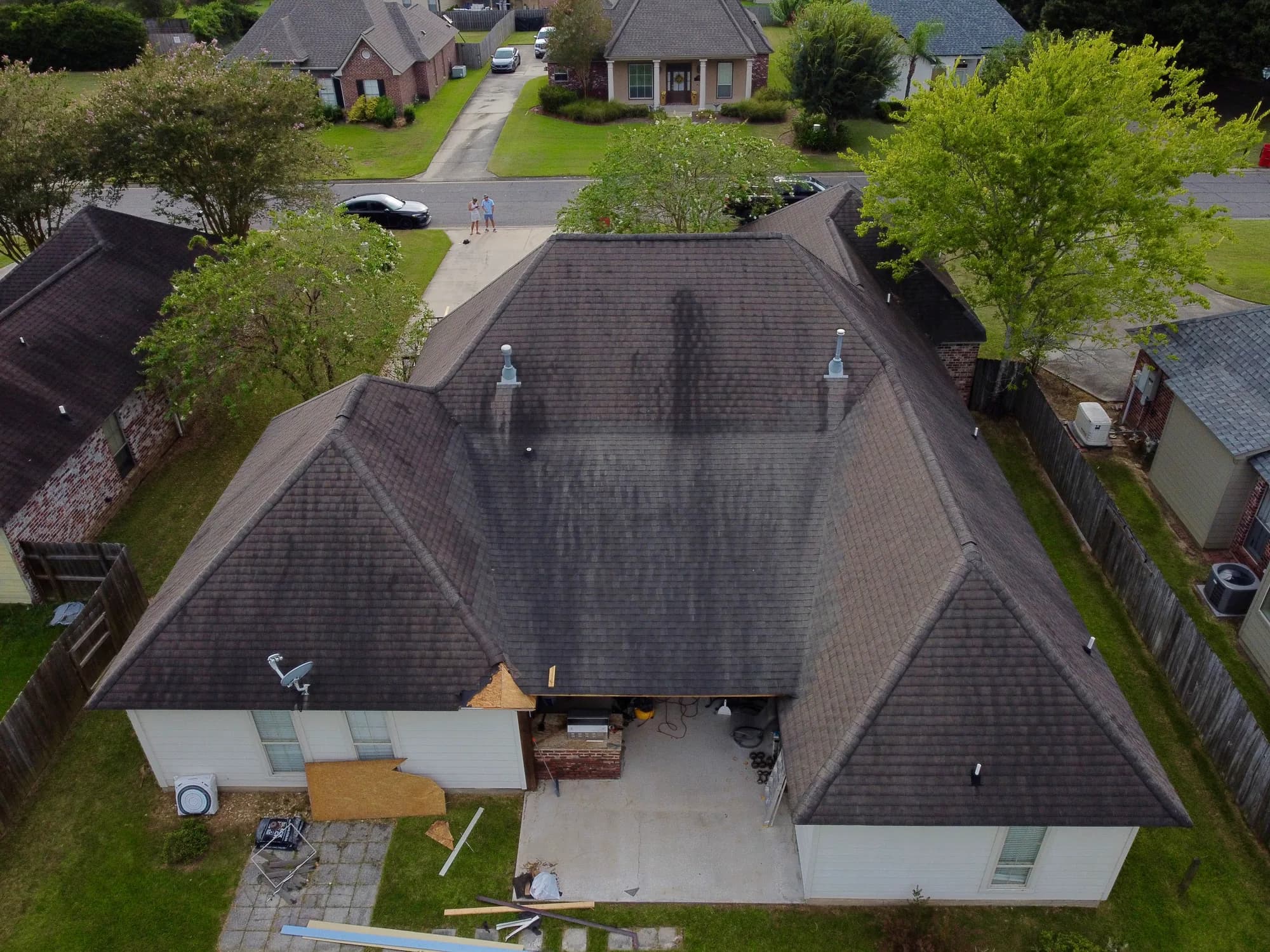 Rear view of the home before roof replacement